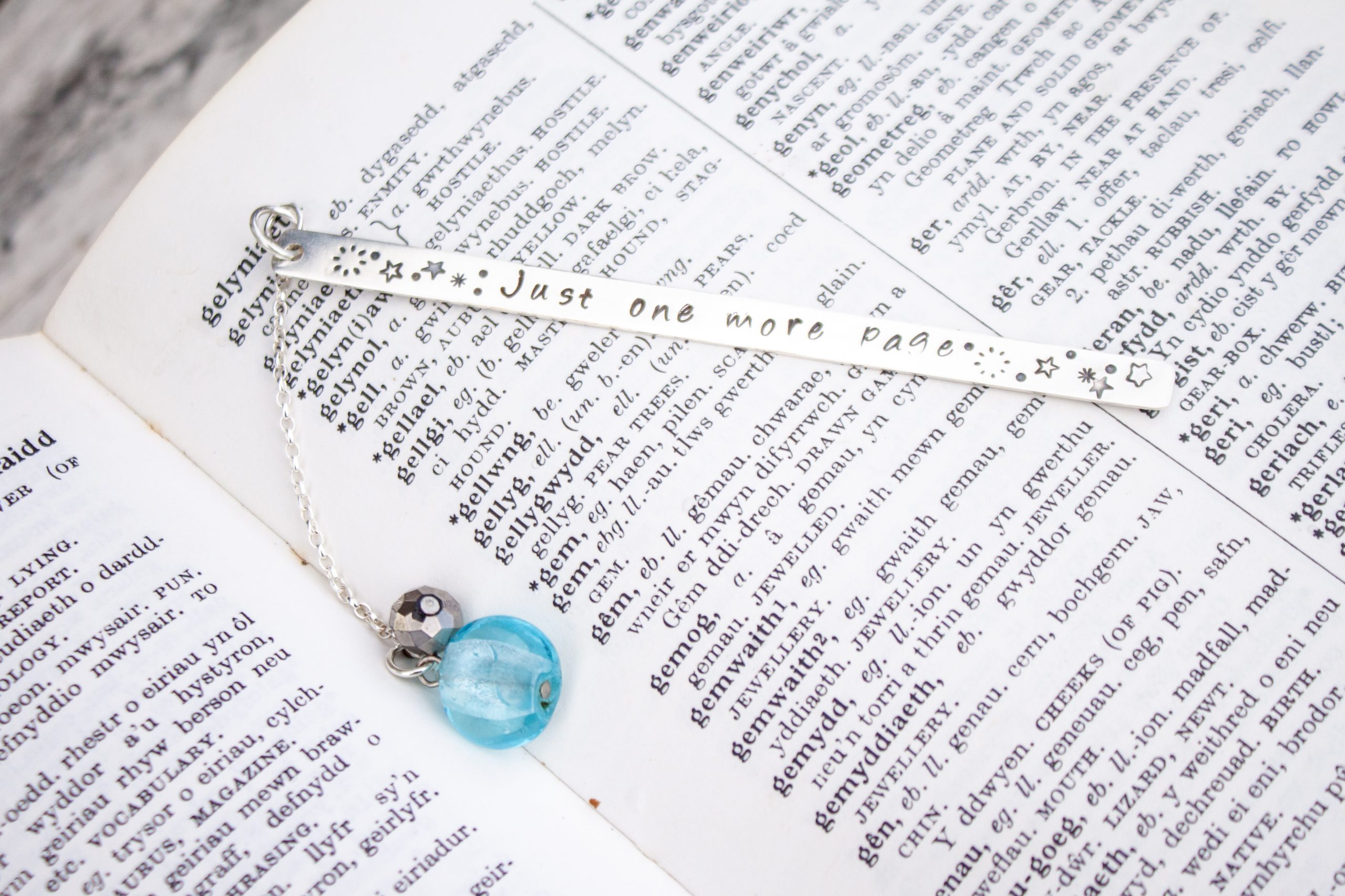 Just One More Page stamped silver bookmark