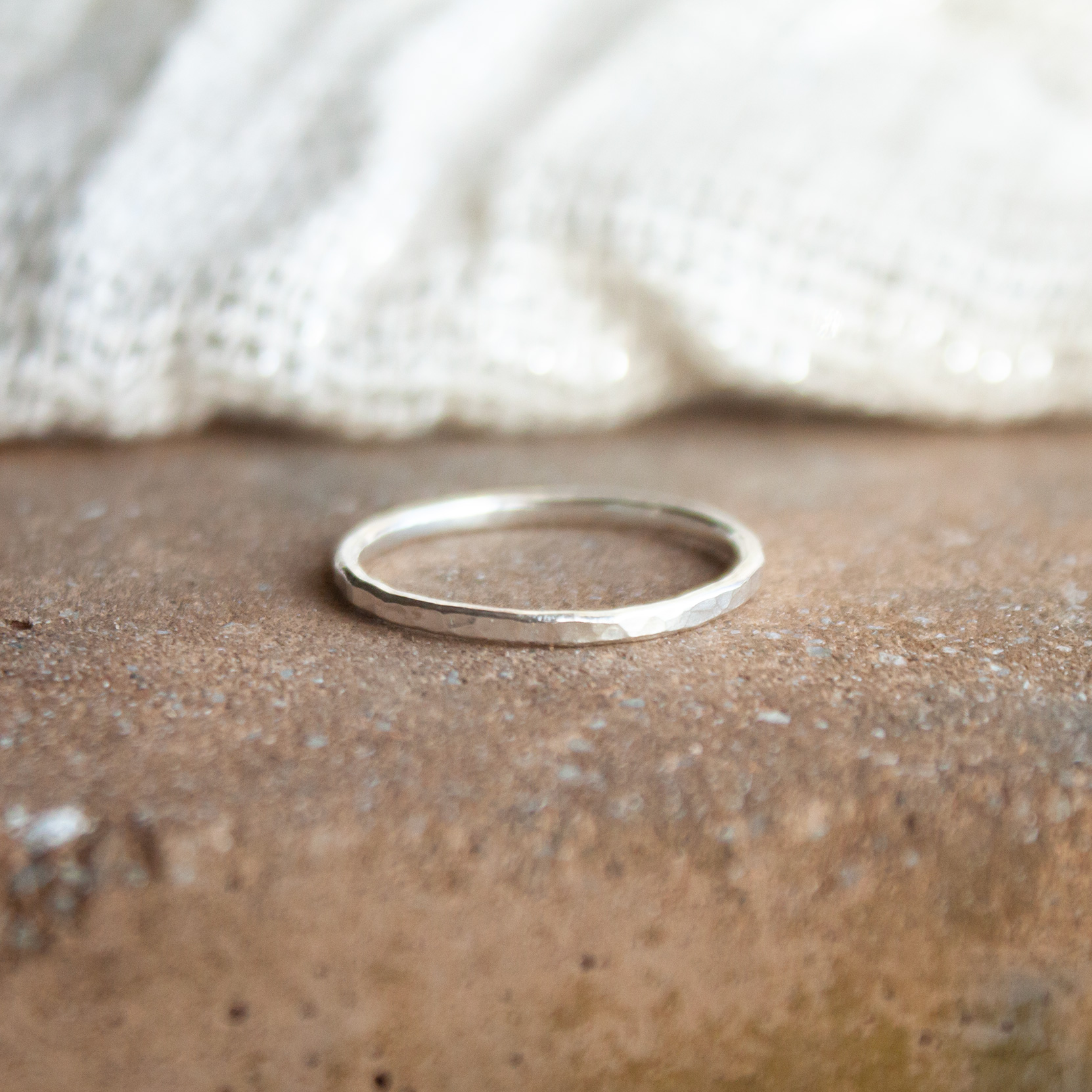 Skinny hammered silver stacker ring